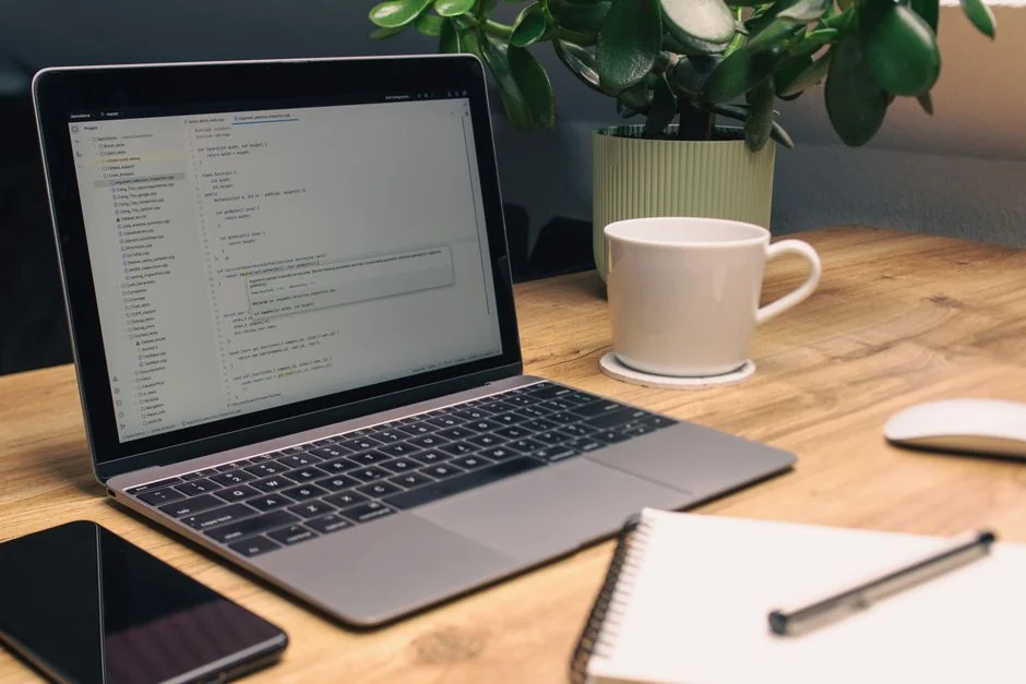 A contemporary workspace showcasing a laptop, tablet, and smartphones, ideal for tech and freelance use.